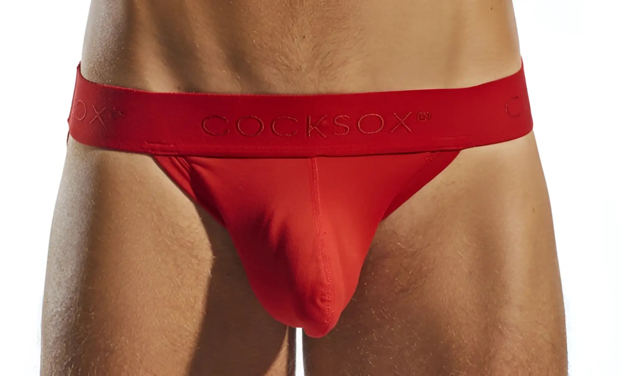 Red cocksox cx21n jockstrap briefs in red with smooth form-fitting fabric and elastic waistband with embossed logo