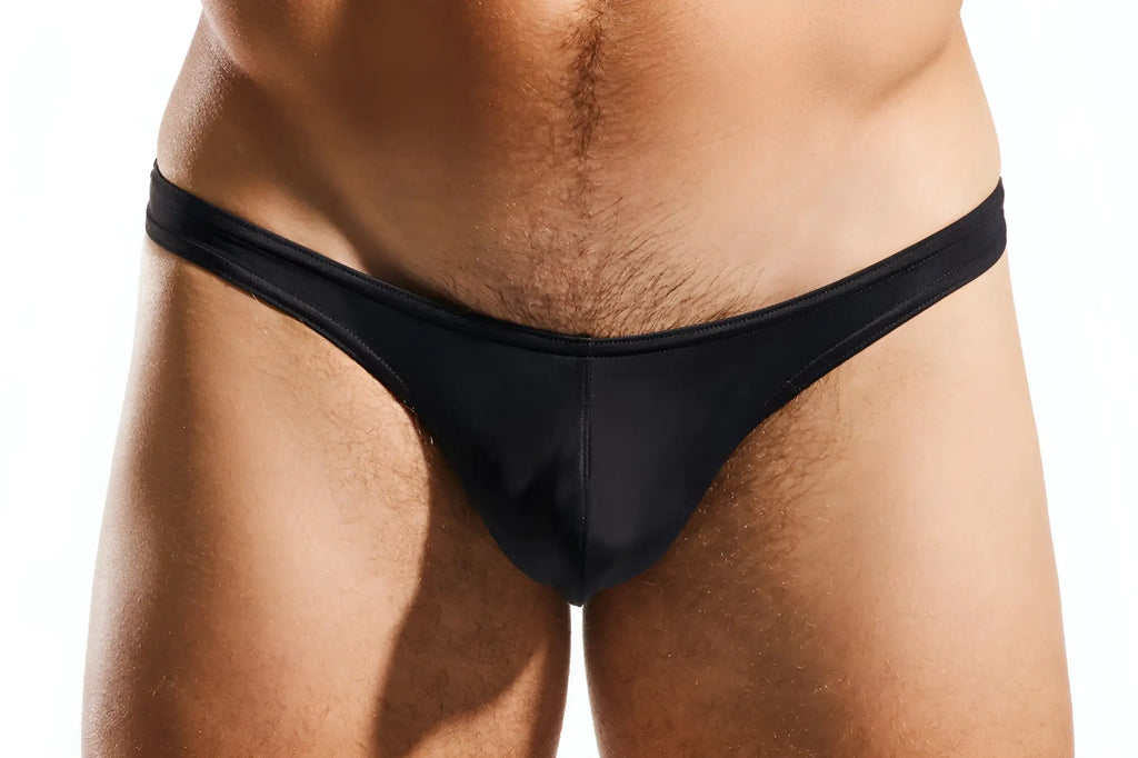 Black sleek form-fitting cx22 swim thong made of smooth fabric shown from the back side