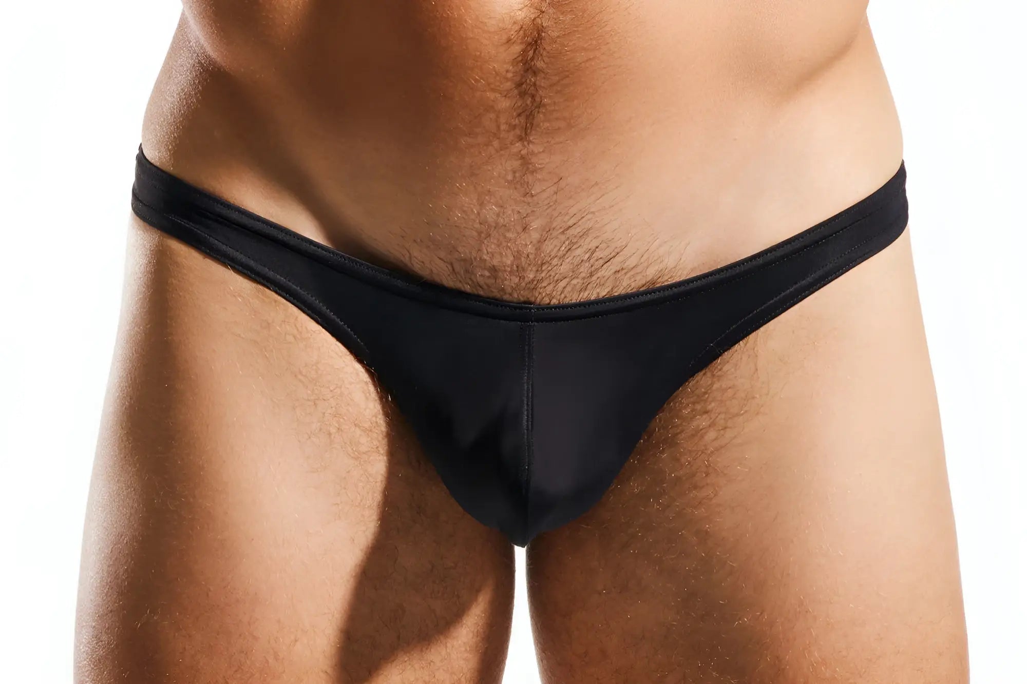 Black sleek form-fitting cx22 swim thong made of smooth fabric shown from the back side