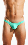 A sleek turquoise cx22 swim thong made of smooth stretchy fabric shown from the back side