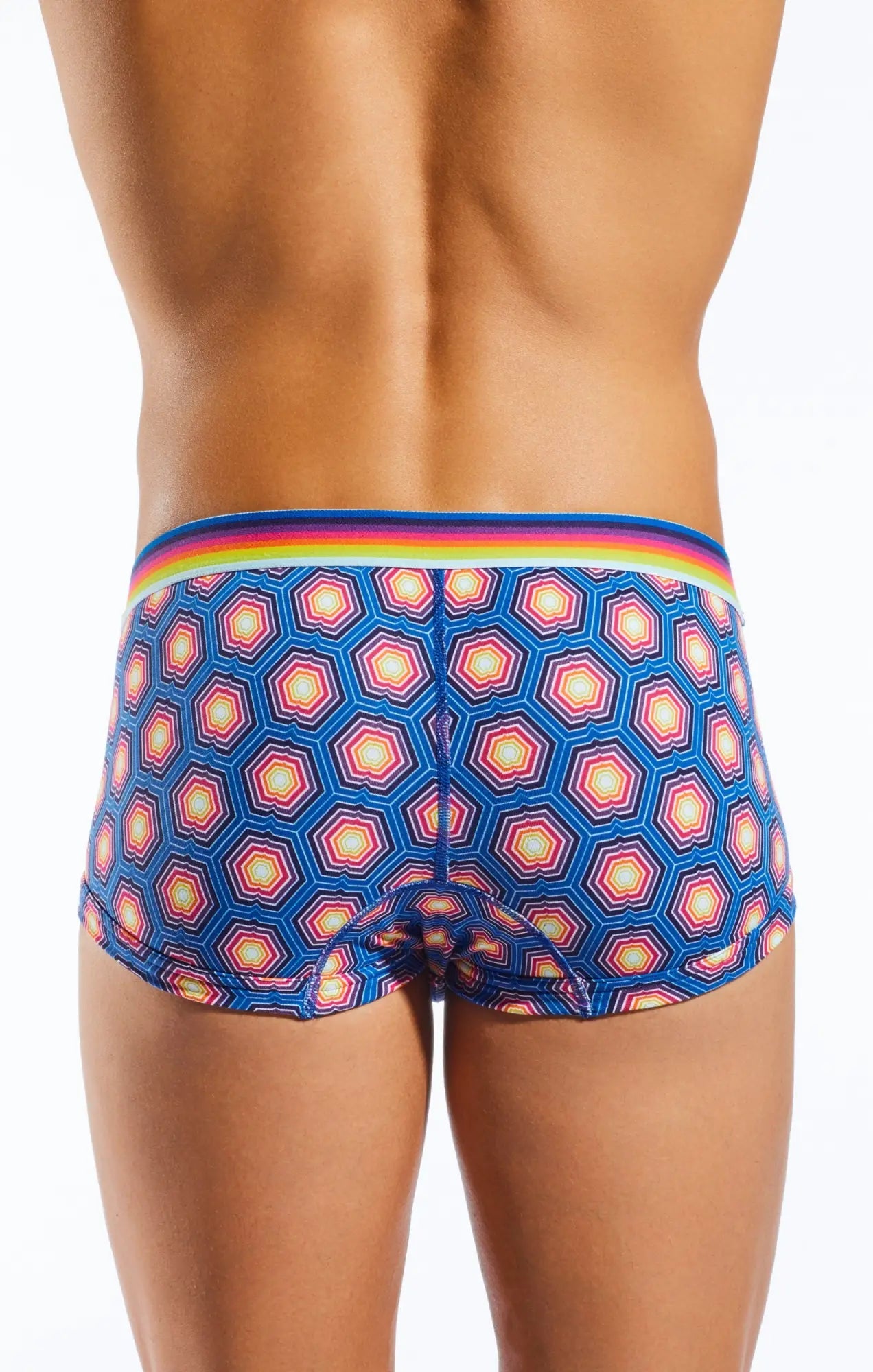 Cx68n trunk blue briefs with geometric hexagonal pattern in pink white and yellow and a rainbow-striped waistband