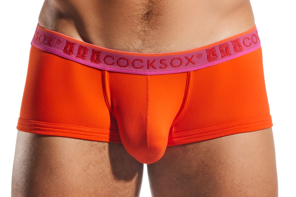 Bright orange men’s briefs with pink waistband featuring cocksox brand name in red cx68n trunk style