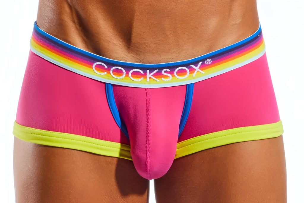 Bright pink cocksox men’s briefs cx68n trunk with rainbow-striped waistband and neon yellow trim