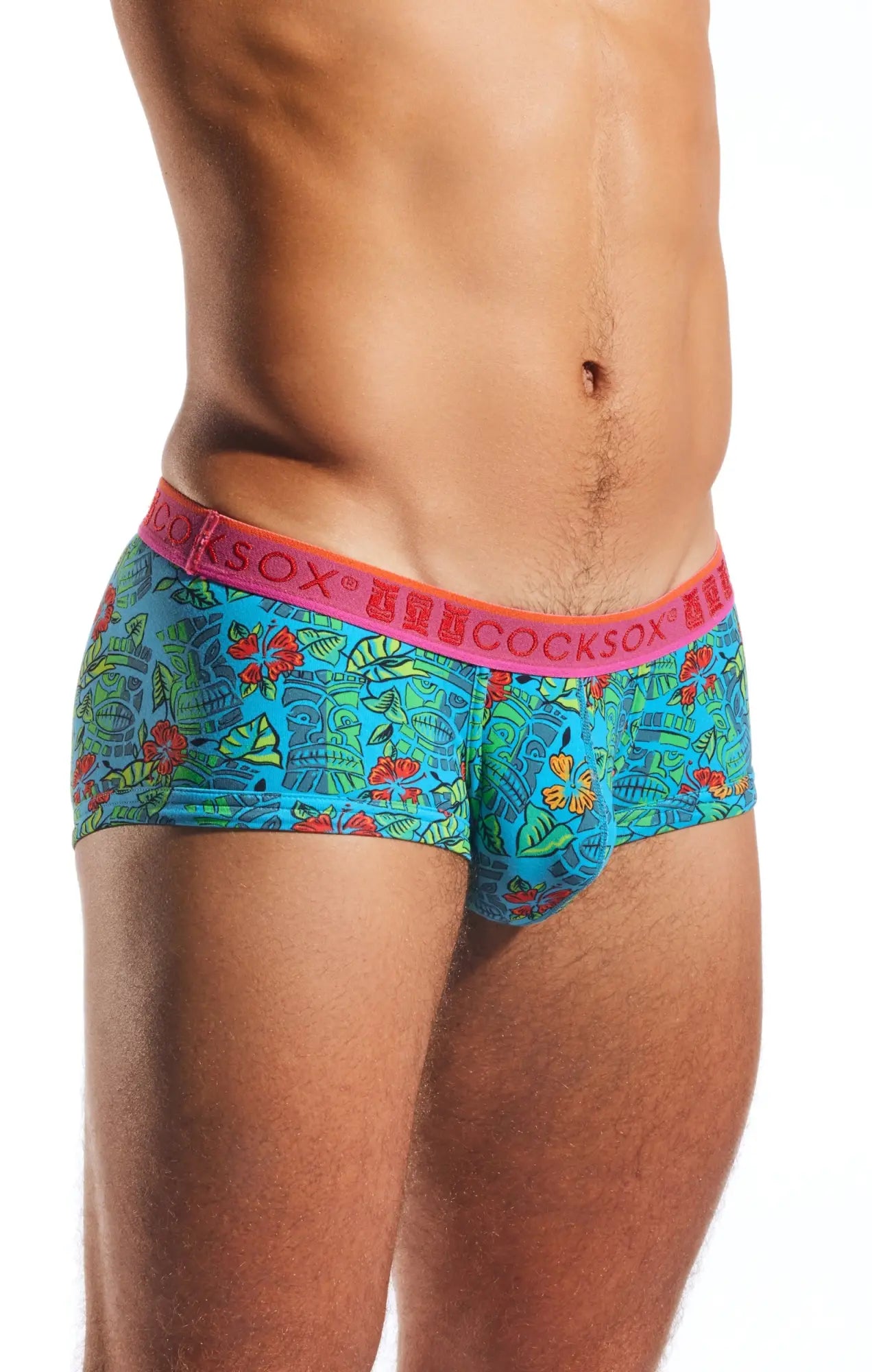 Bright turquoise tropical-patterned men’s briefs with pink waistband featuring cocksox brand name cx68n trunk