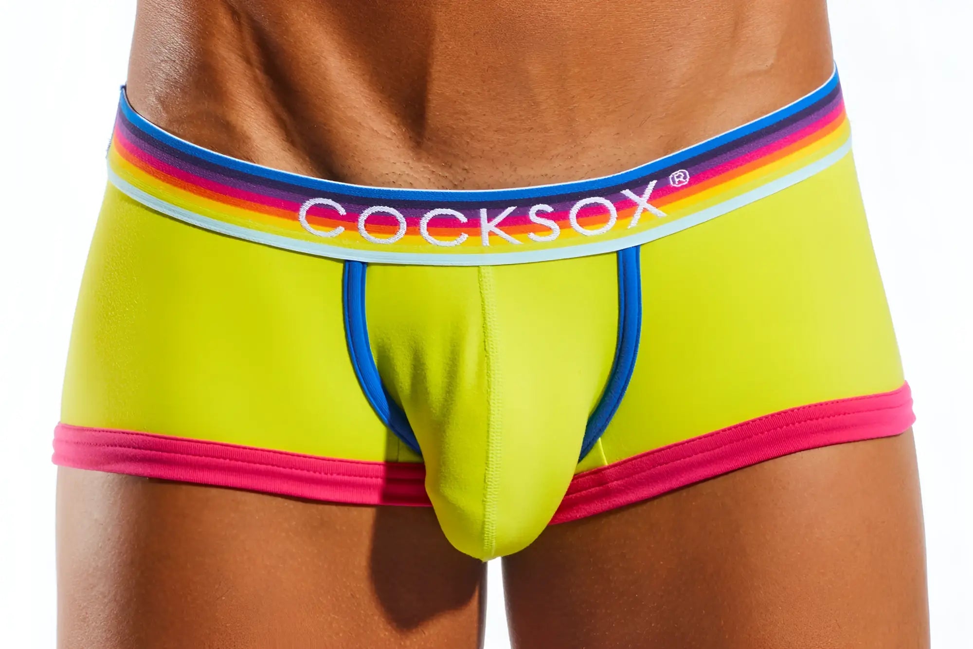 Vibrant lime green cocksox men’s briefs cx68n trunk with rainbow-striped waistband and bold pink trim