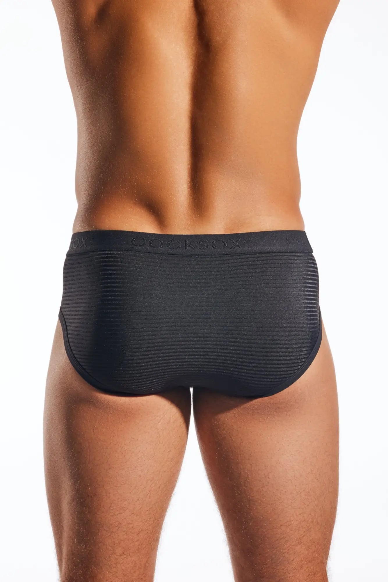 Black cx76lux semi-sheer sports briefs with ribbed texture and bulkbox branded waistband for athletic use