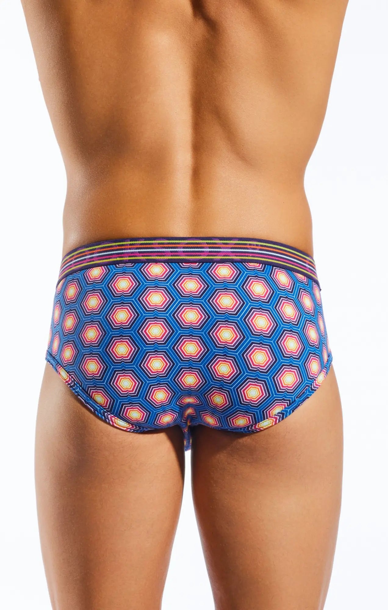 Blue cx76n sports brief swim trunks with vibrant pink orange and white hexagon geometric pattern