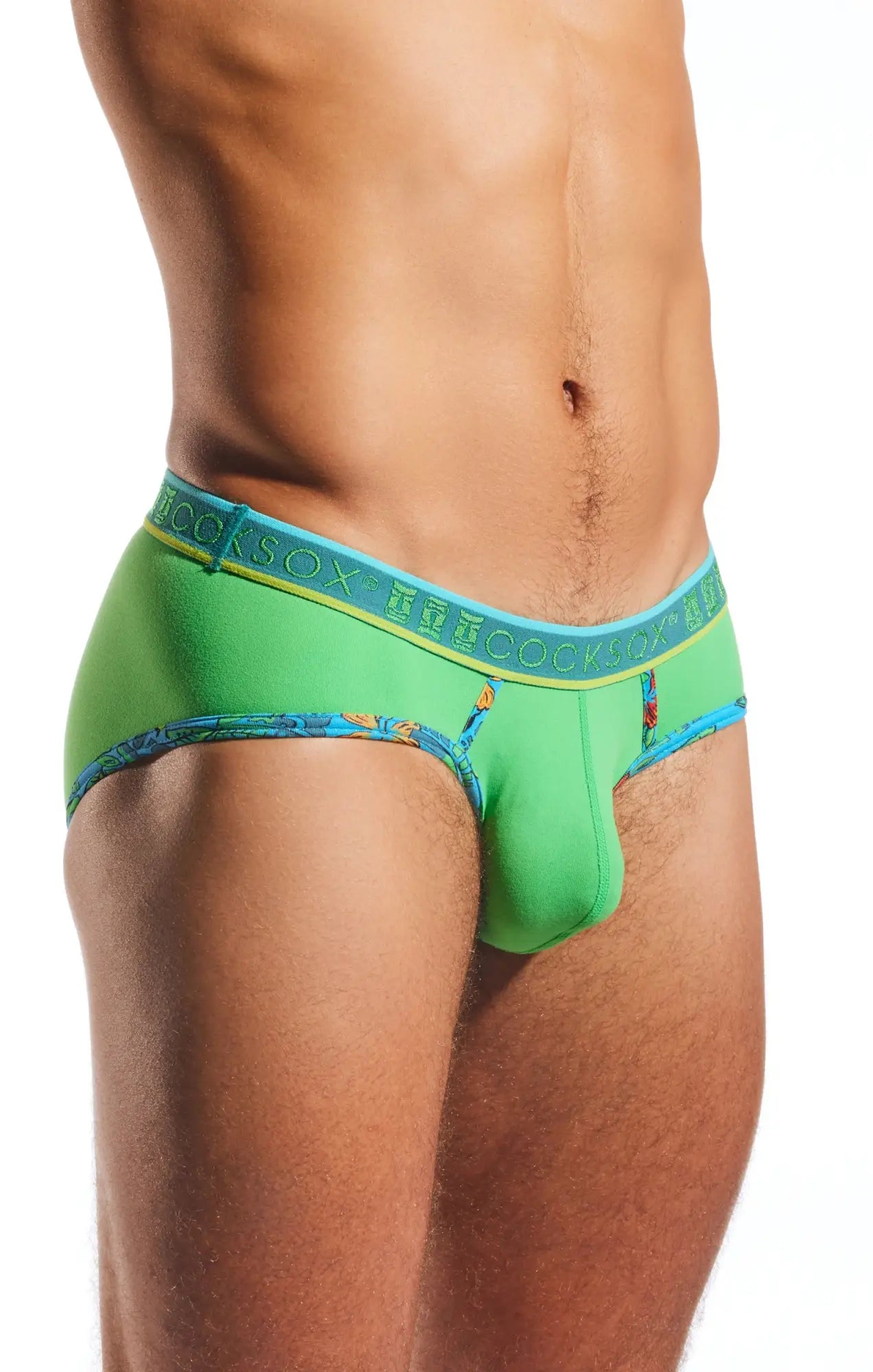 Bright green cx76n sports briefs with blue waistband featuring cocksox branding and decorative leg edge patterns