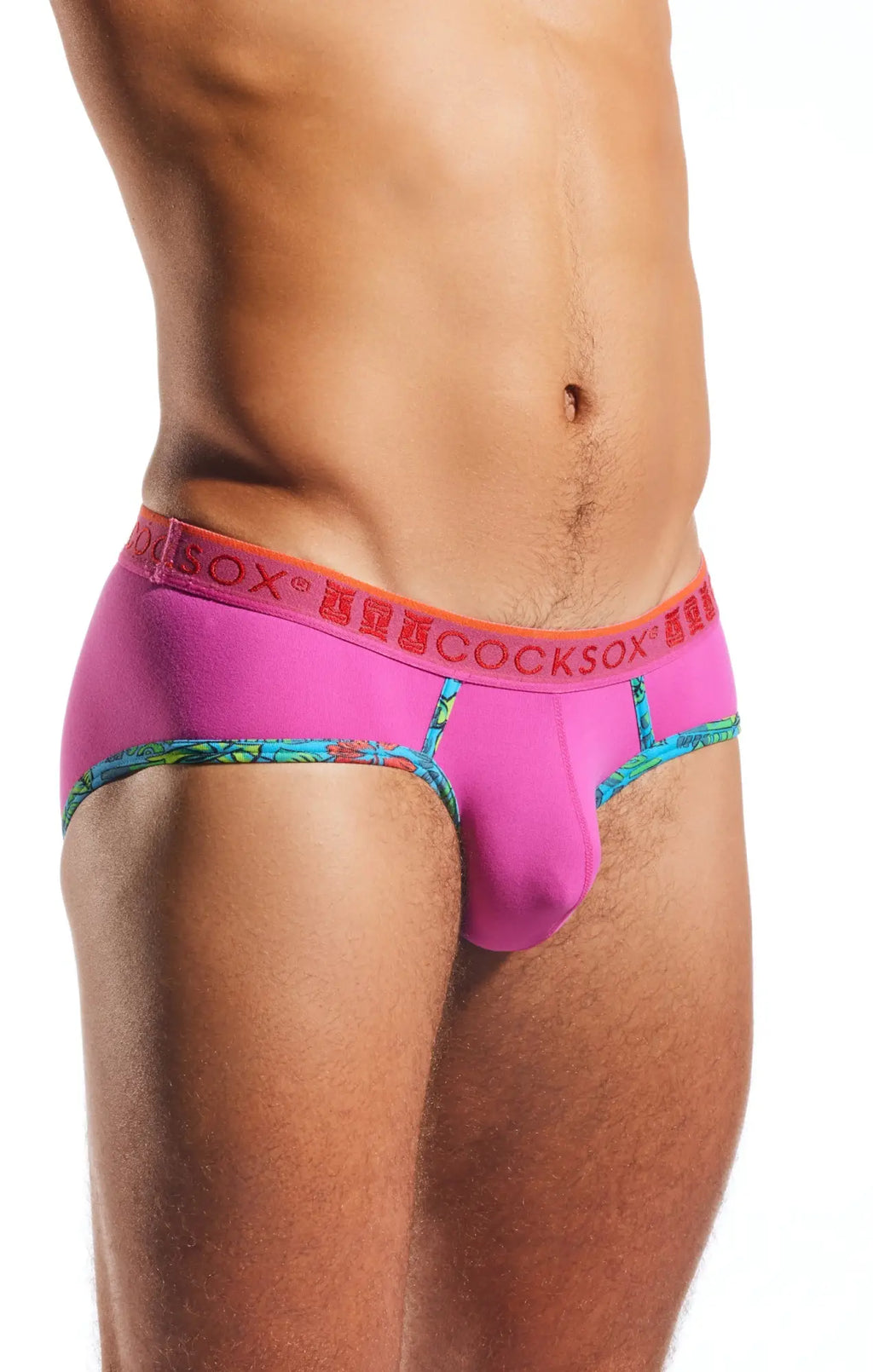 Vibrant pink cocksox cx76n sports briefs with bold orange waistband and colorful patterned trim for men