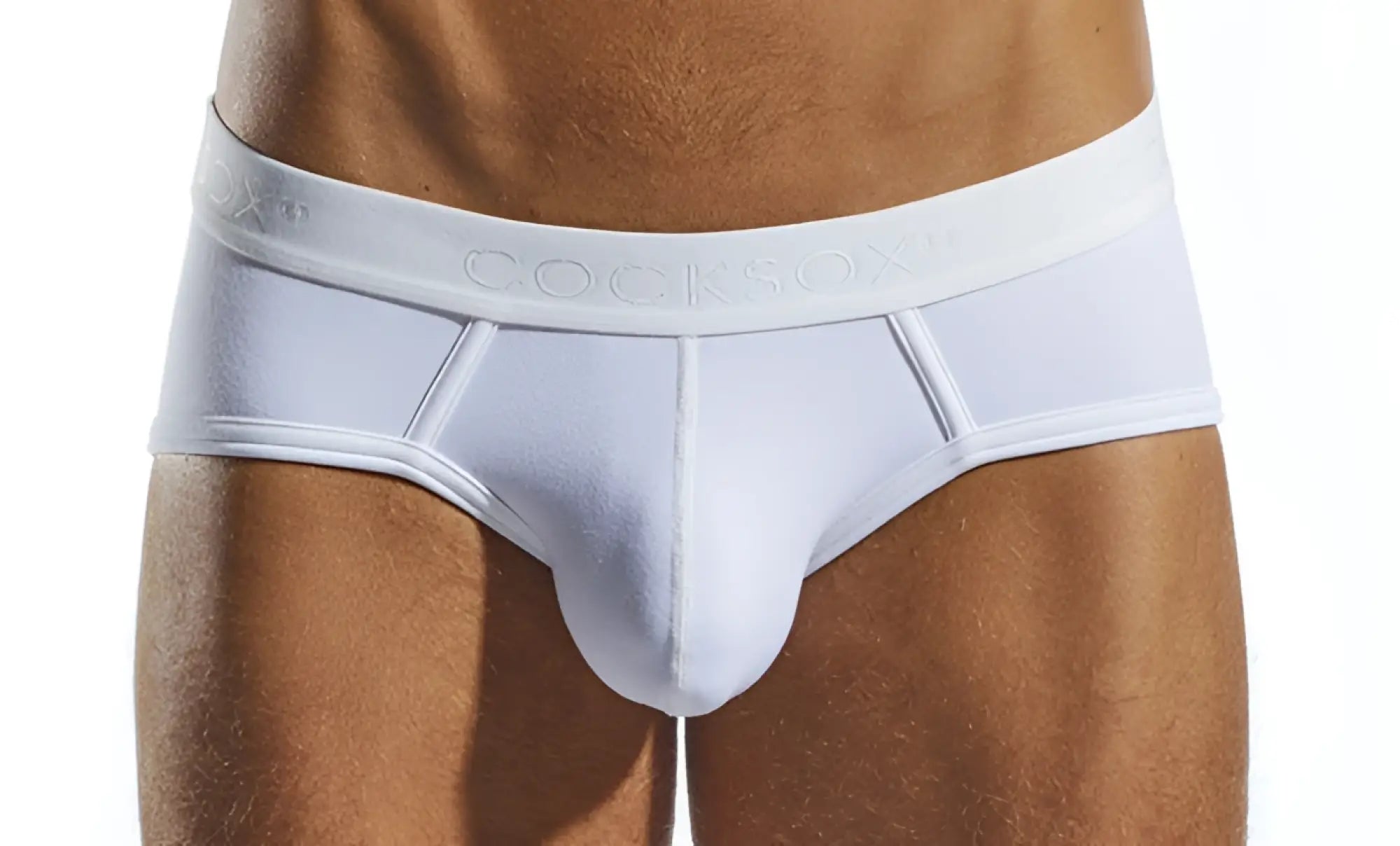 White cocksox cx76n sports brief in white with smooth form fitting design and subtle embossed waistband branding