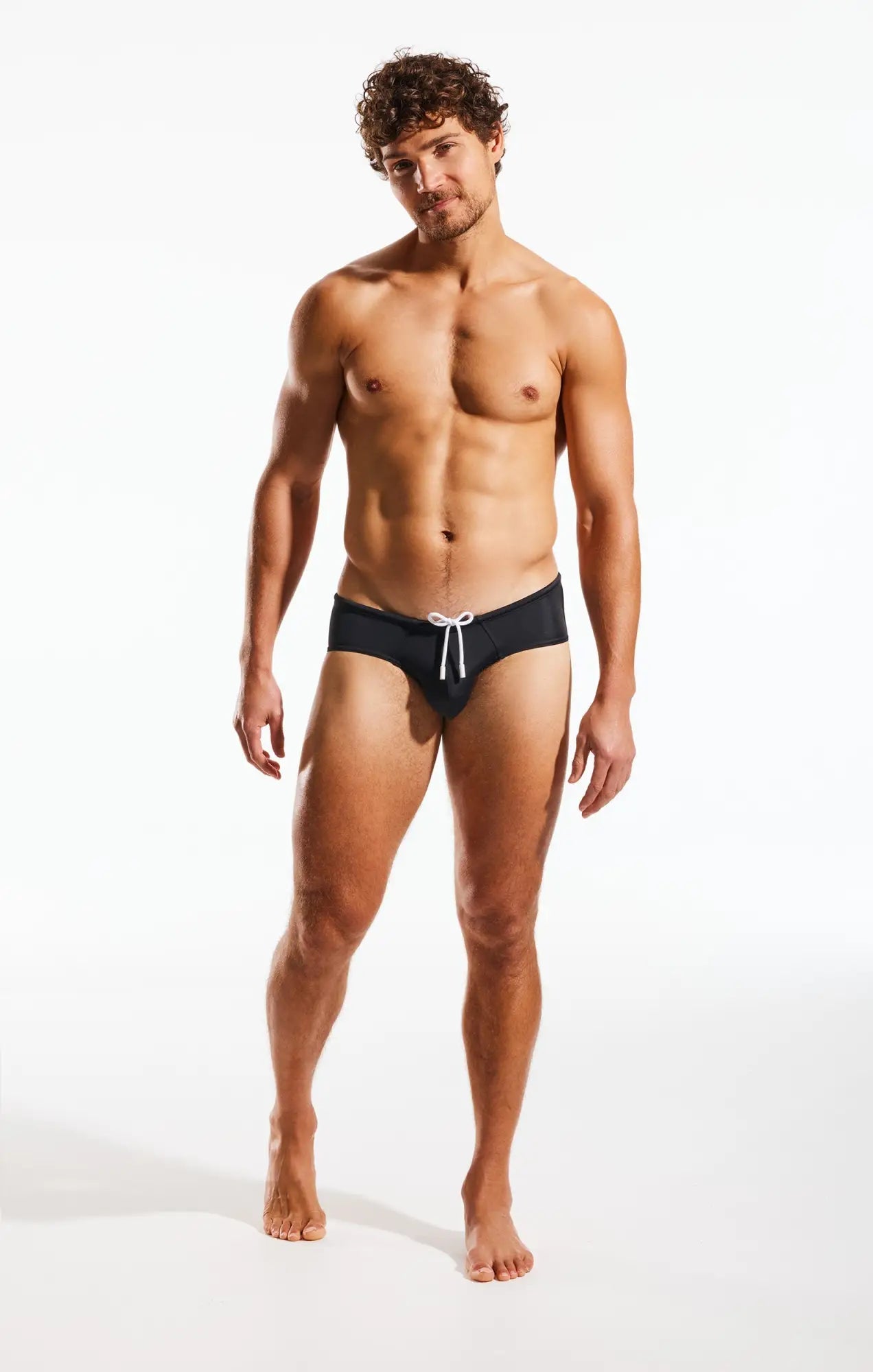 Cx79 boy leg swim brief in black swim trunks with white drawstring for comfortable water activities