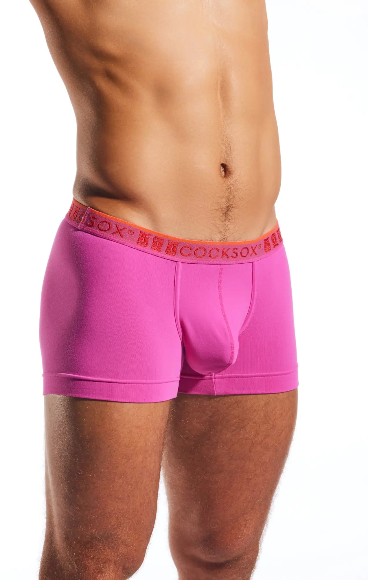 Bright pink cx94 boxer briefs with orange waistband featuring cocksox brand name in repeating lettering