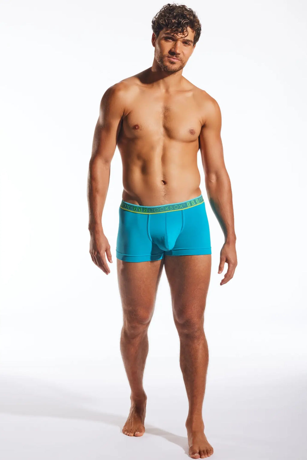 Turquoise blue cx94 men’s boxer briefs with a green elastic waistband featuring the brand name