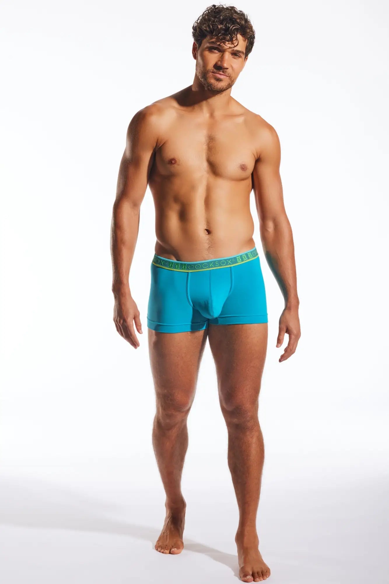 Turquoise blue cx94 men’s boxer briefs with a green elastic waistband featuring the brand name