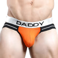 Orange and black daddy dde001 jockstrap briefs with a silver waistband featuring bold black lettering