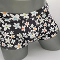 Black briefs daisy sq cut with playful white daisies and colorful orange blue purple centers in soft fabric