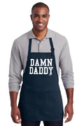 Navy blue cotton apron with white damn daddy text and two front pockets ideal for cooking or grilling