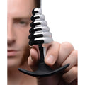 Dark Hive metal and silicone ribbed anal plug with sleek chrome tiered spiral design and black ergonomic base