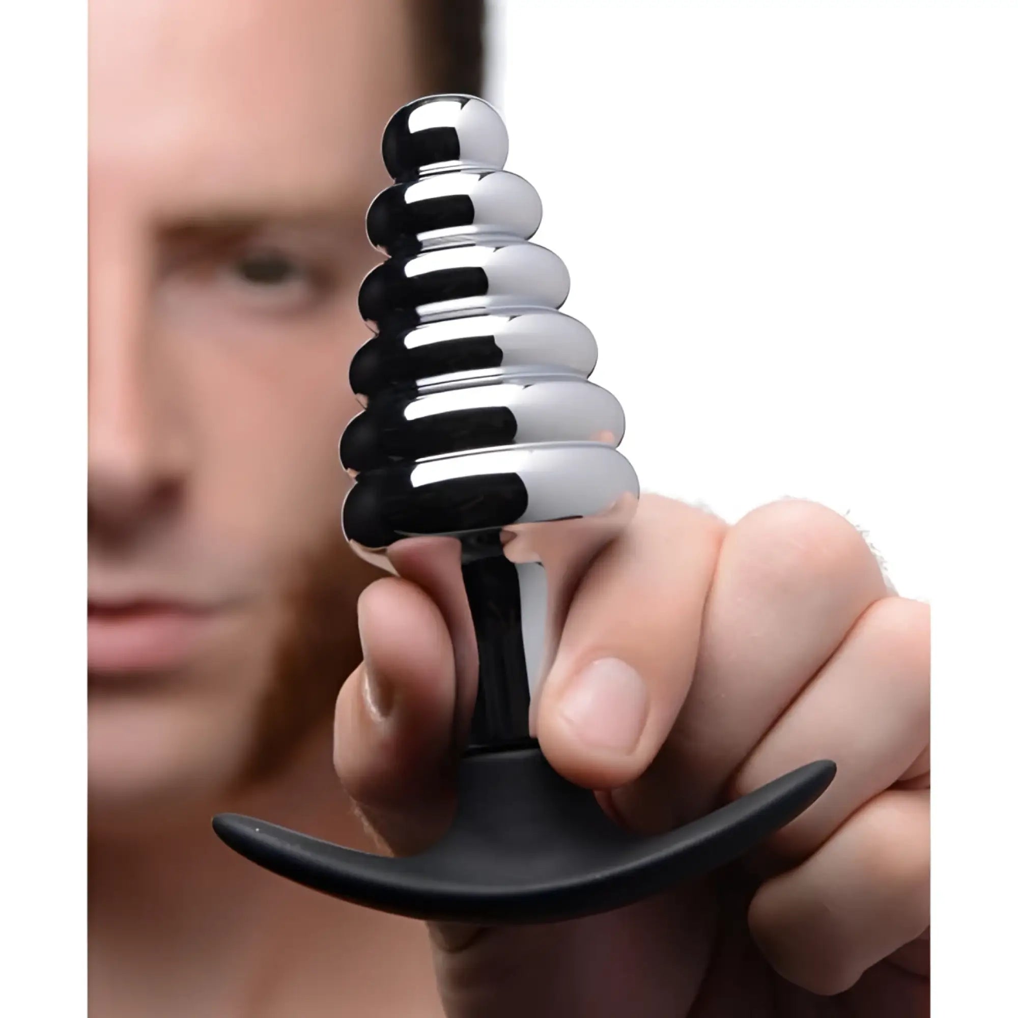 Dark Hive metal and silicone ribbed anal plug with sleek chrome tiered spiral design and black ergonomic base