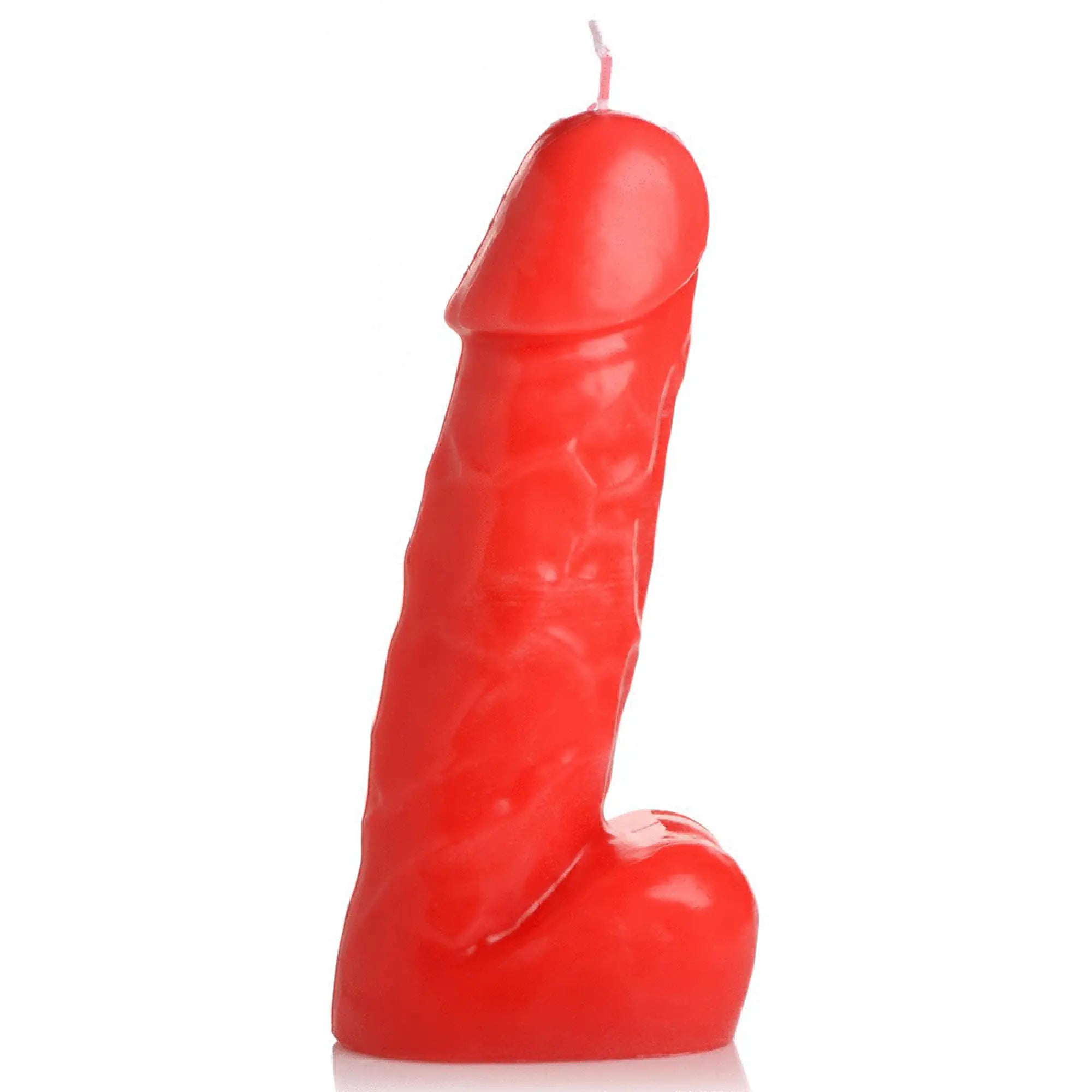 A vibrant red glossy dark pecker dick drip candle shaped like a detailed phallic form with a single wick on top