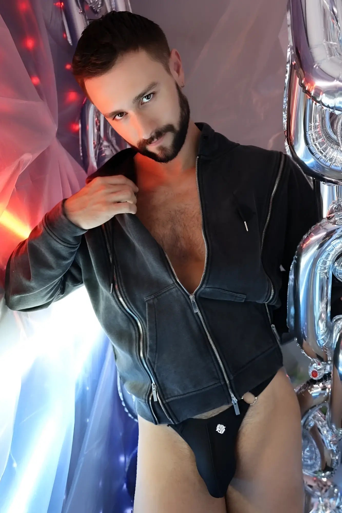 Black leather darkroom hoodie with silver zippers and front zipper closure for stylish outerwear use