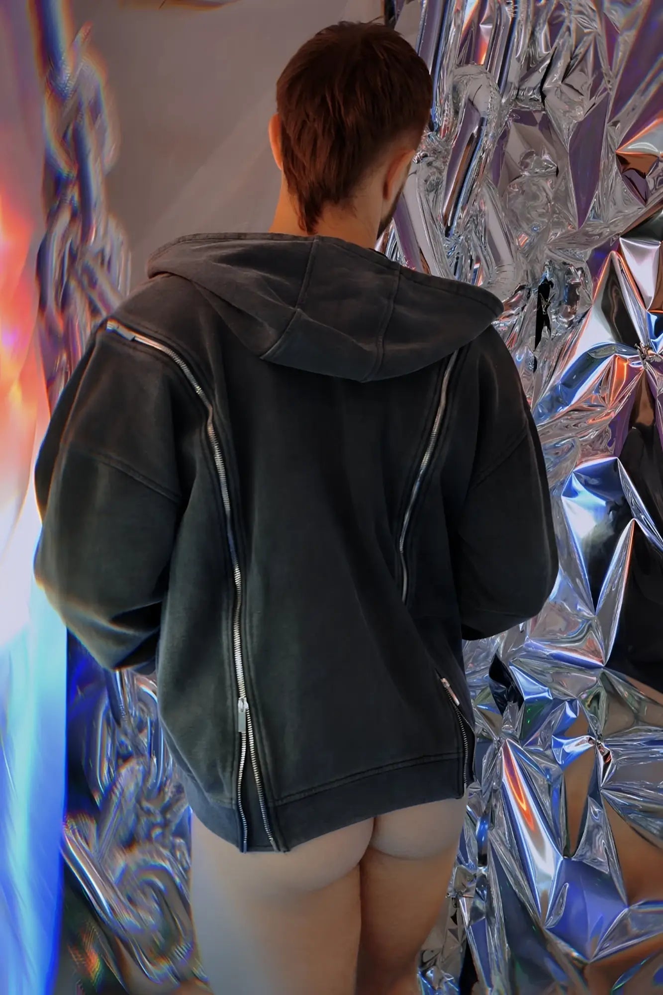 Black hoodie with silver zippers made from soft fabric featured in the darkroom hoodie collection