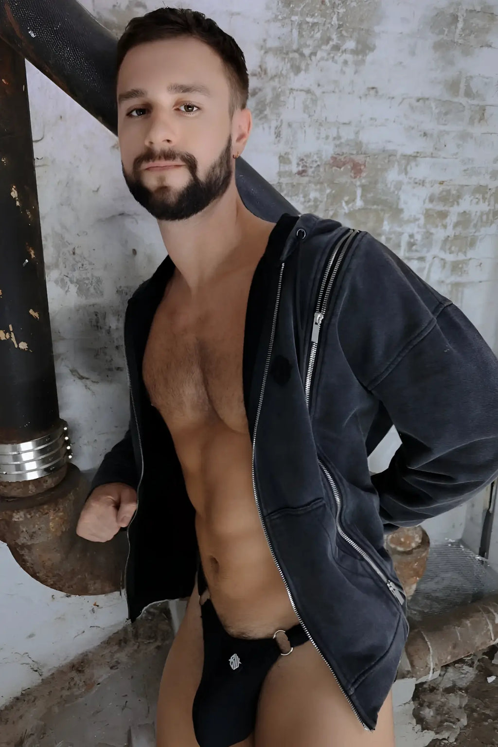 Black velvet darkroom hoodie with silver zippers paired with matching briefs featuring a small metallic emblem