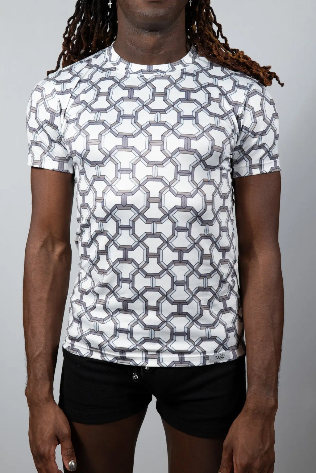 White short-sleeved rash guard with black and gray geometric chain-link pattern in designer inspired print tee style