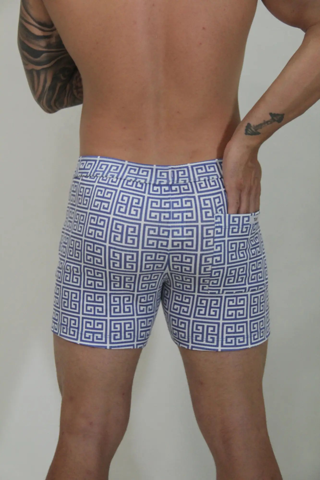 Designer print linen texture shorts in blue and white geometric pattern swim trunks for casual summer wear