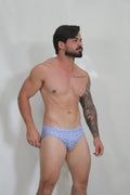 Designer print swim brief in blue and white geometric pattern made of lightweight quick-dry fabric for swimming