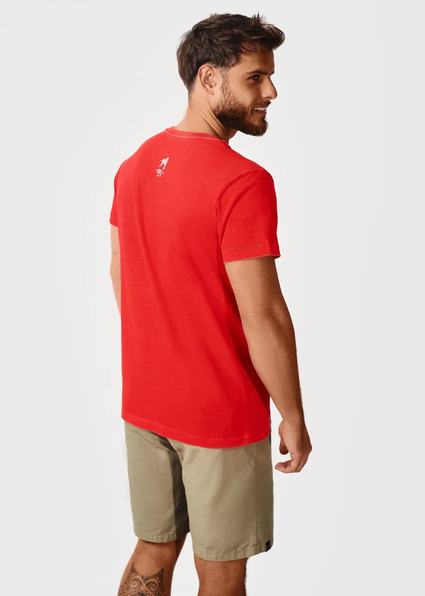 Back view of red destination jfk ny men’s short-sleeved t-shirt with small white logo on upper back