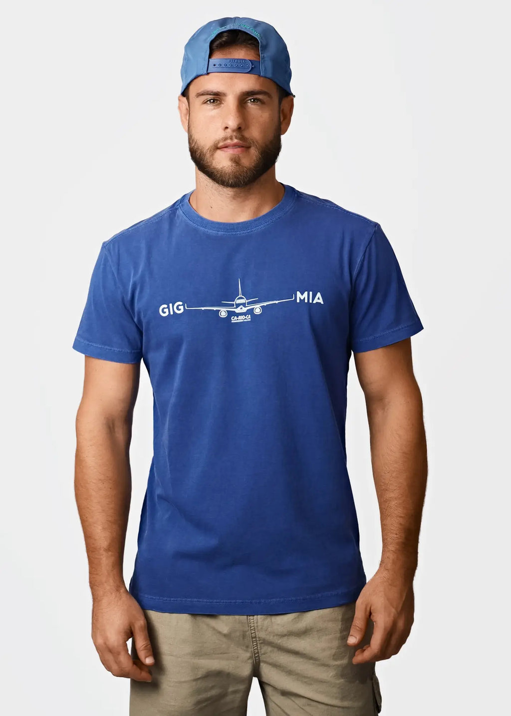 Blue cotton men’s t-shirt featuring a white airplane graphic with gig and mia text from destination mia miami collection