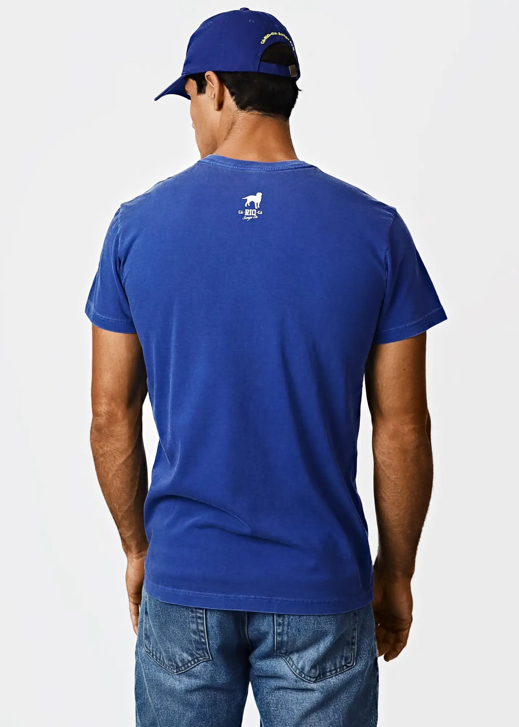 Back side of a royal blue cotton men’s t-shirt with a small white horse logo and destination MIA text