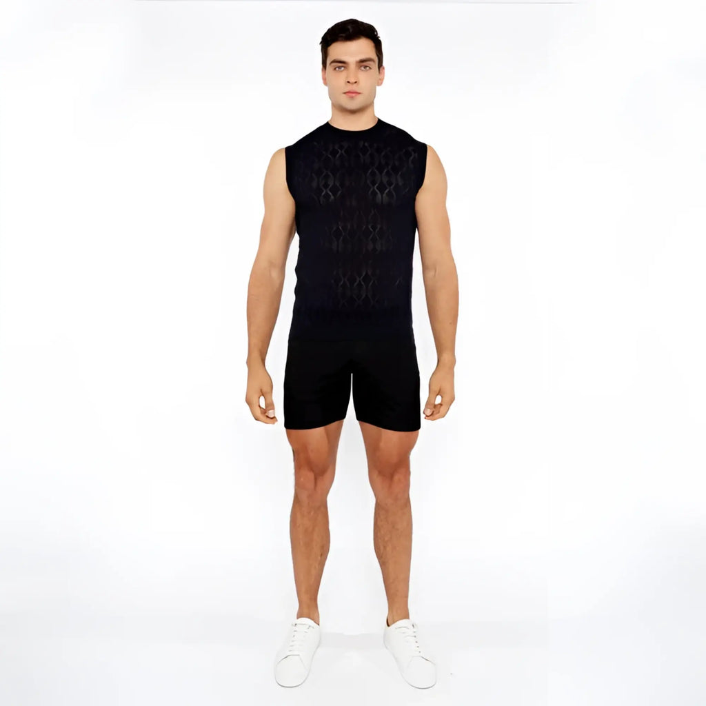 Black sleeveless diamond pointelle knit vest featuring an intricate geometric pattern and lightweight fabric