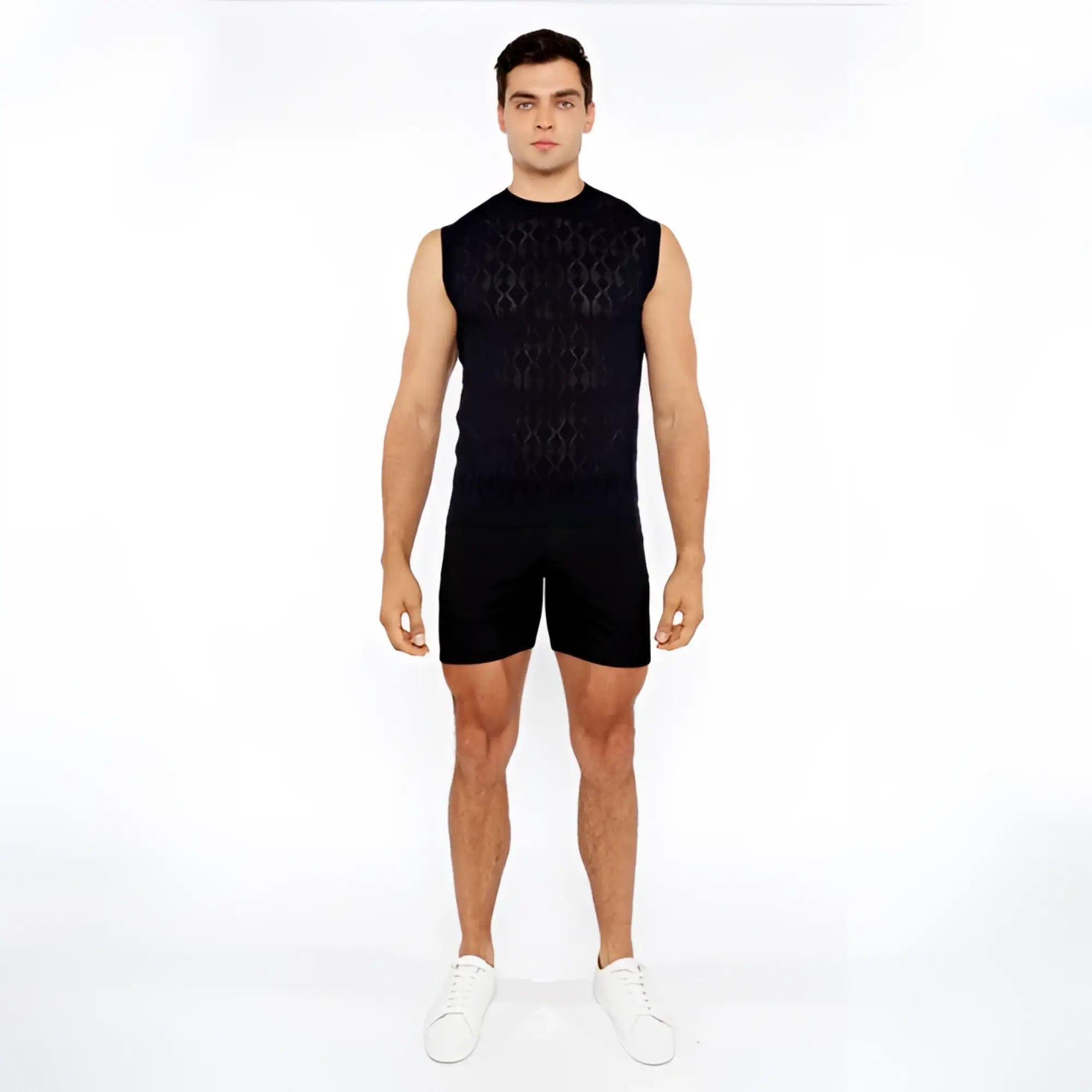 Black sleeveless diamond pointelle knit vest featuring an intricate geometric pattern and lightweight fabric