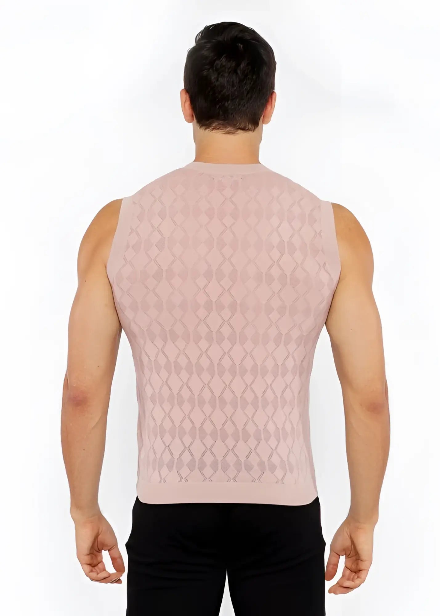 A pink knitted sleeveless vest with a diamond-patterned texture made from soft yarn