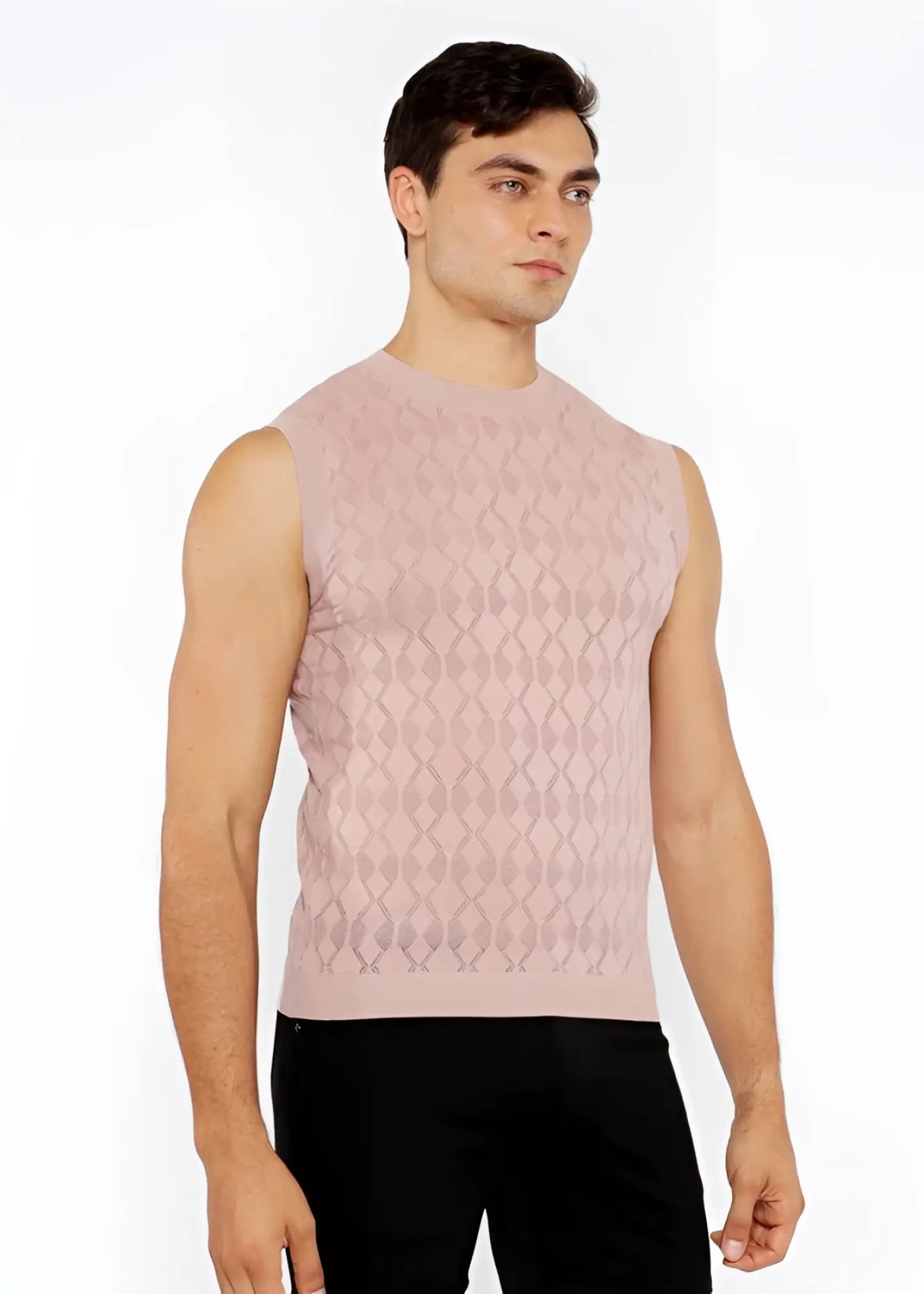 A soft pink sleeveless diamond pointelle knit vest with subtle diamond-patterned texture