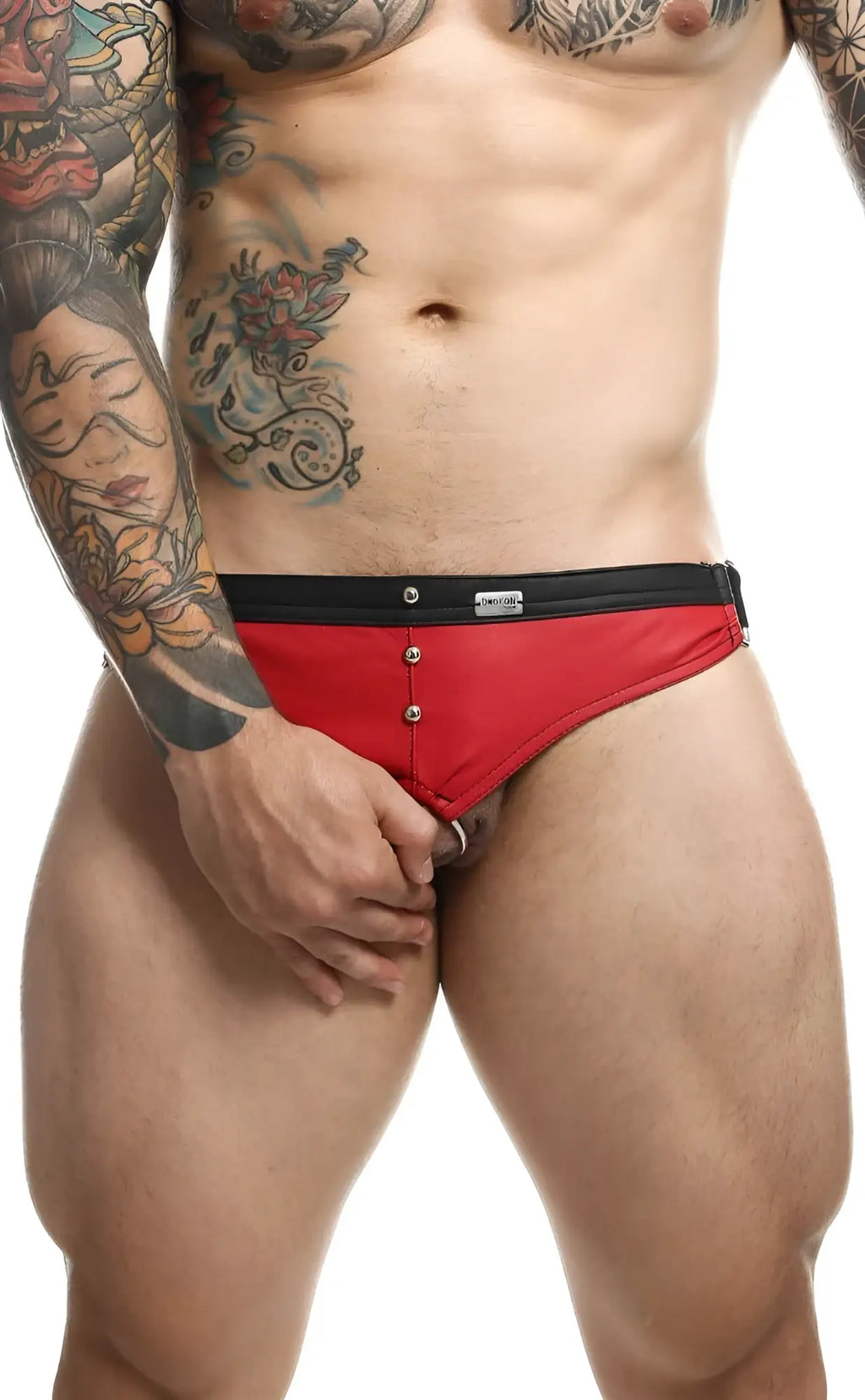 Red and black men’s briefs with button closure from dngeon c-ring jockstrap showing front view