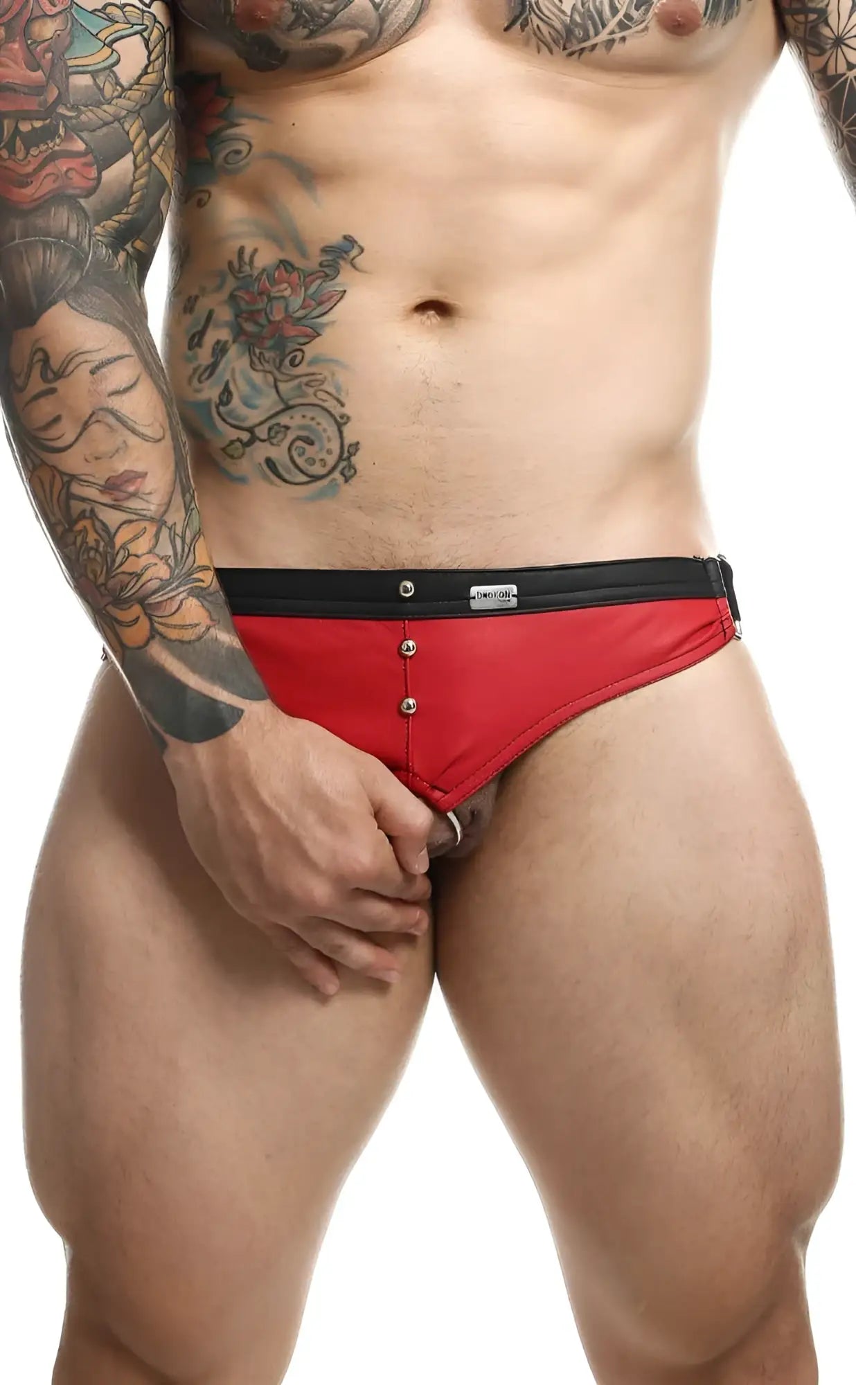 Red and black men’s briefs with button closure from dngeon c-ring jockstrap showing front view