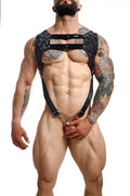 Black lace croptop harness with metal clasps and rings by dngeon in camo showing the back side