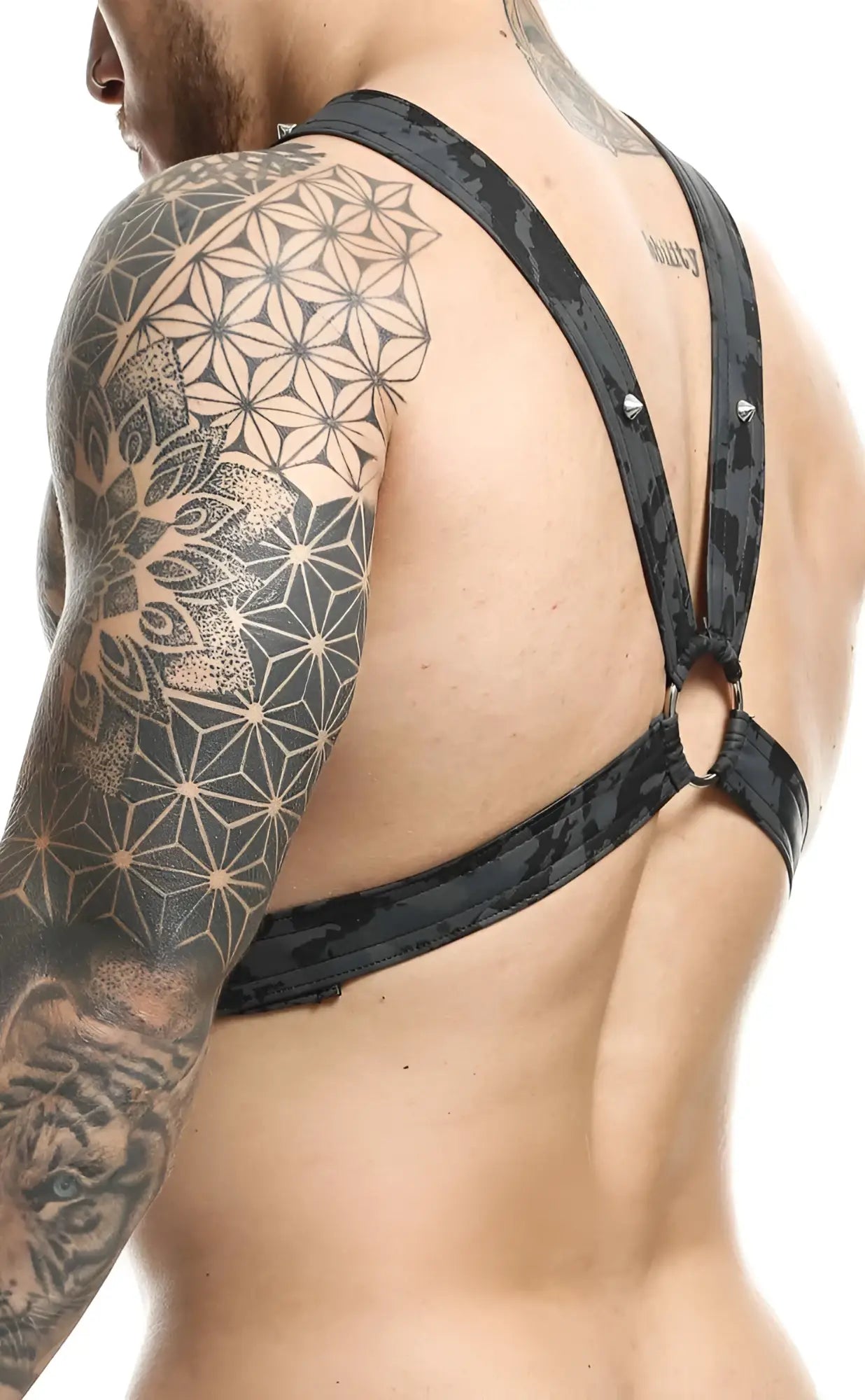 Dngeon cross chain harness in black camouflage pattern with metallic hardware designed for secure fit and style