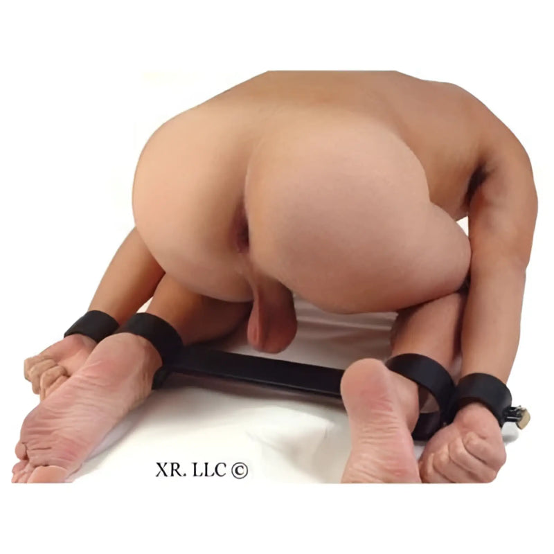 Black leather bondage strap with adjustable buckles and foot cuffs from the doggy style locking spreader