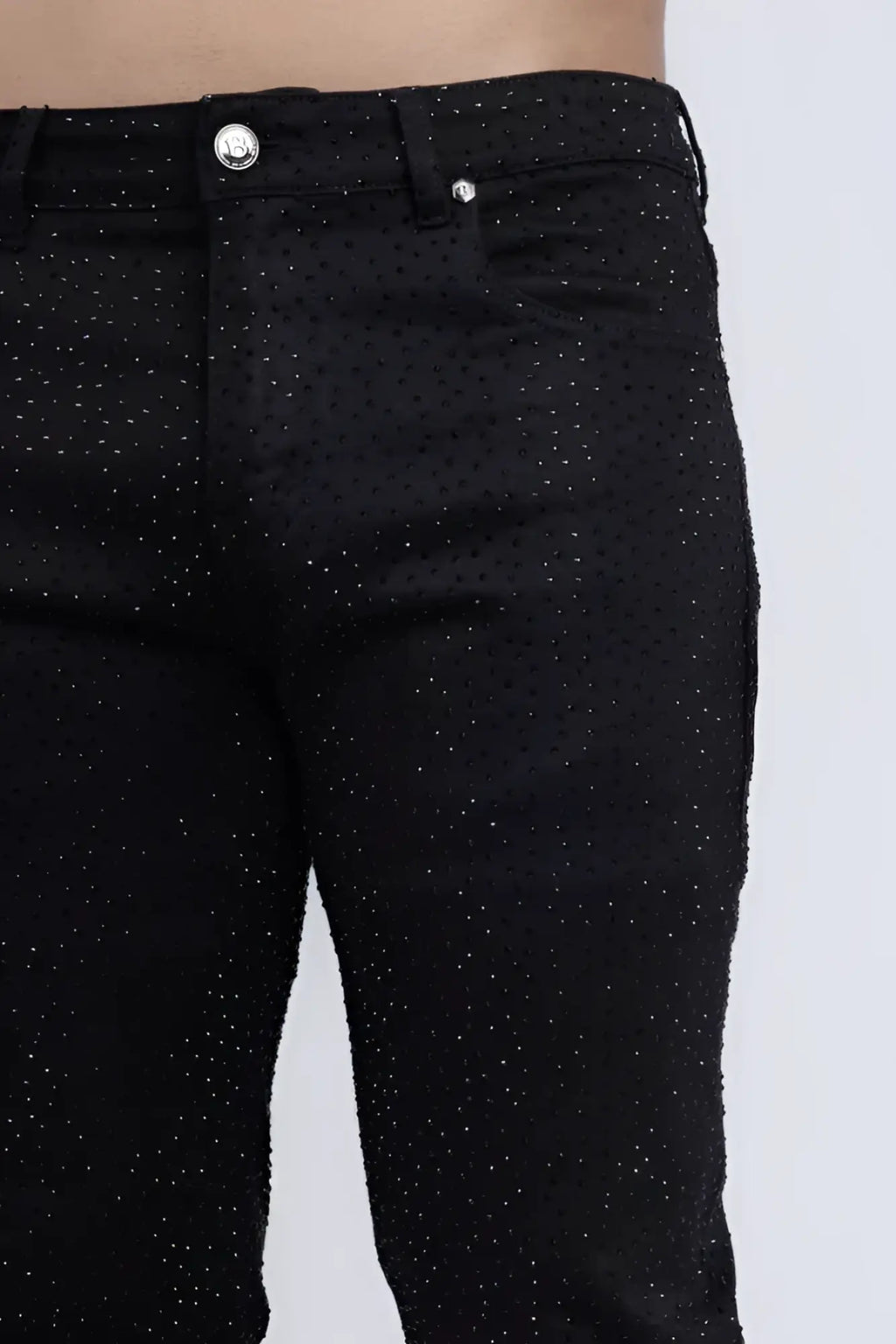 Black denim dolorosa rhinestone jeans with subtle glittery dot pattern and silver toned button closure