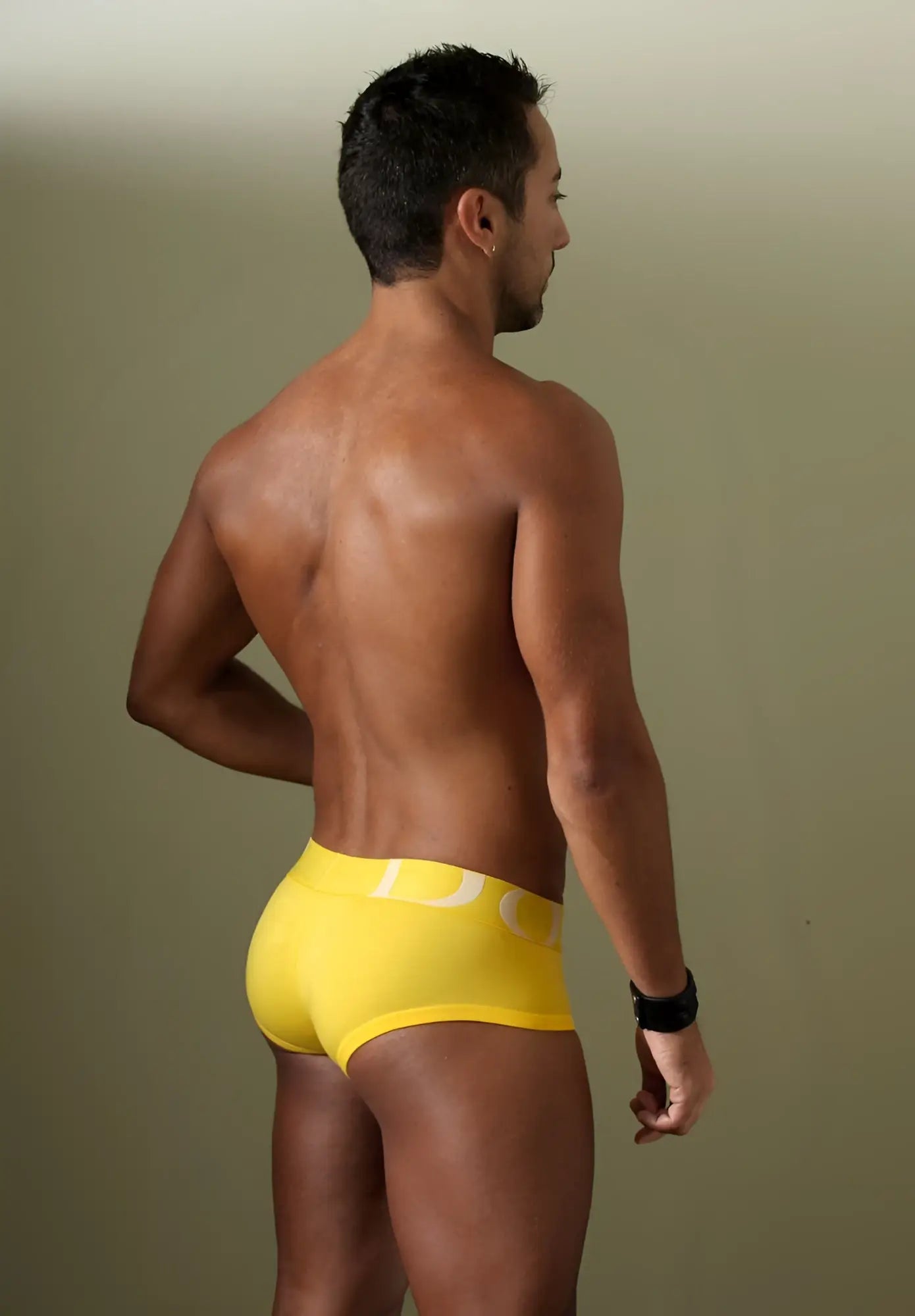 Bright yellow Doreanse 1779-YLW pouch mini trunk briefs with a white logo on the waistband