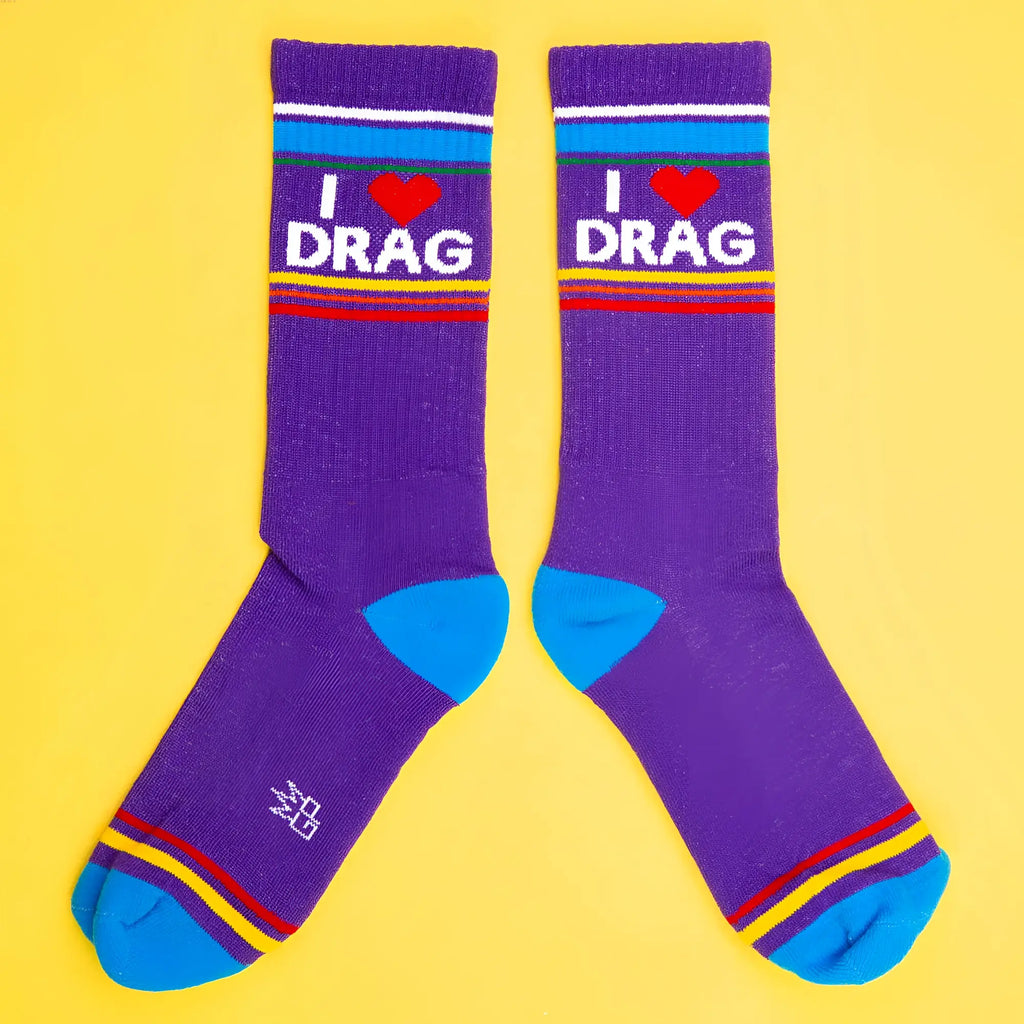 Purple crew socks with i heart drag white lettering red heart blue toe caps and colorful striped bands