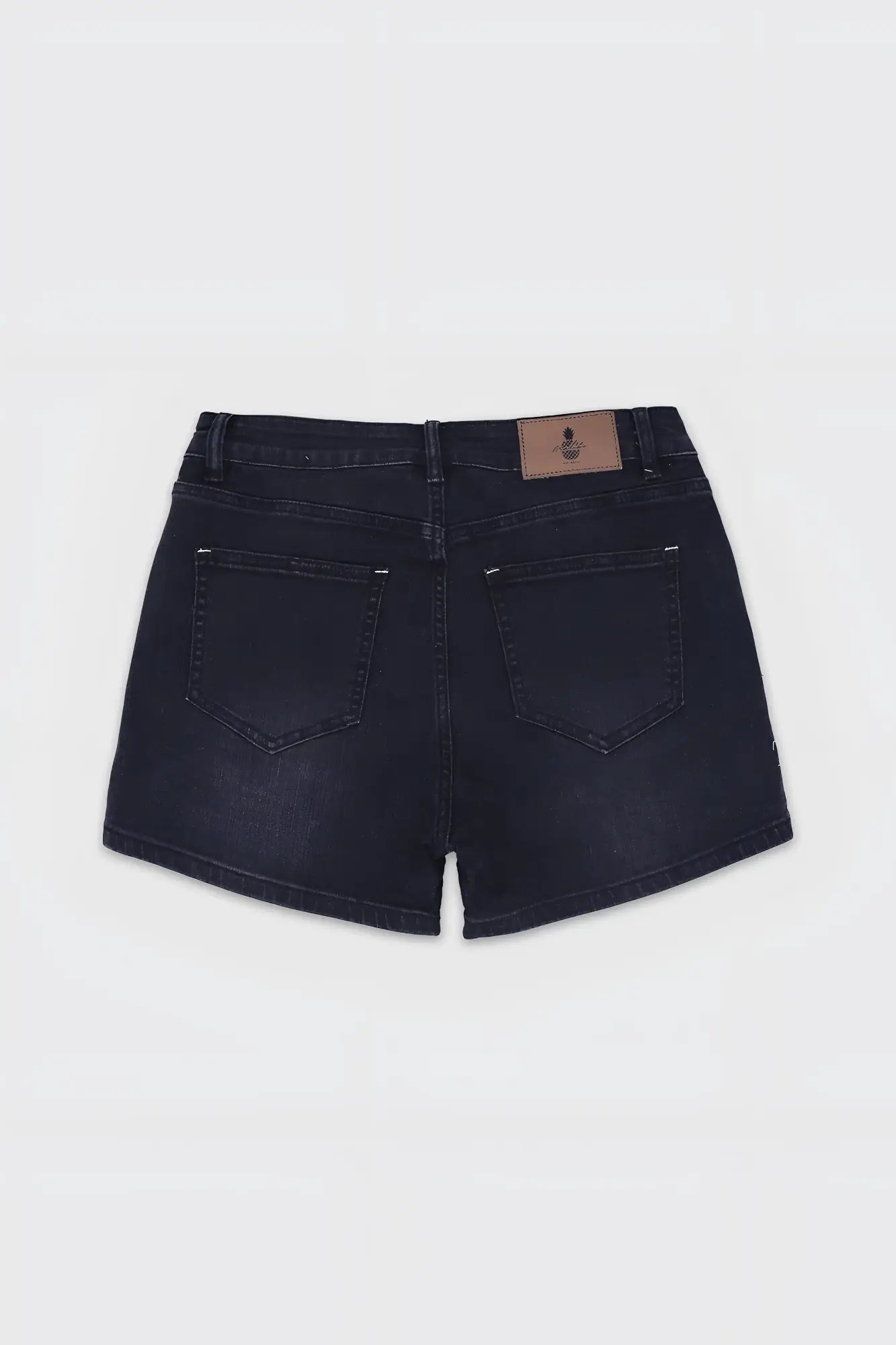 Back view of dark-wash in-your-dreams 3.5 inch denim short shorts with classic pocket design and brown leather patch