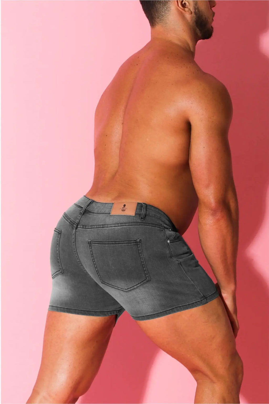 Back side of in-your-dreams 3.5 inch steel grey denim short shorts with classic pockets and brown leather patch