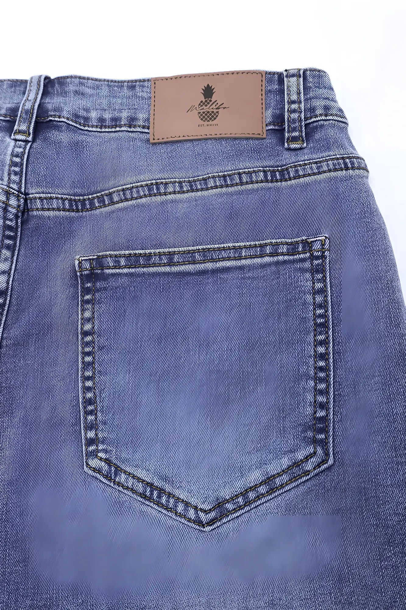 Blue denim in-your-dreams 3.5 inch short shorts with brown leather patch featuring pineapple logo and brand name on back