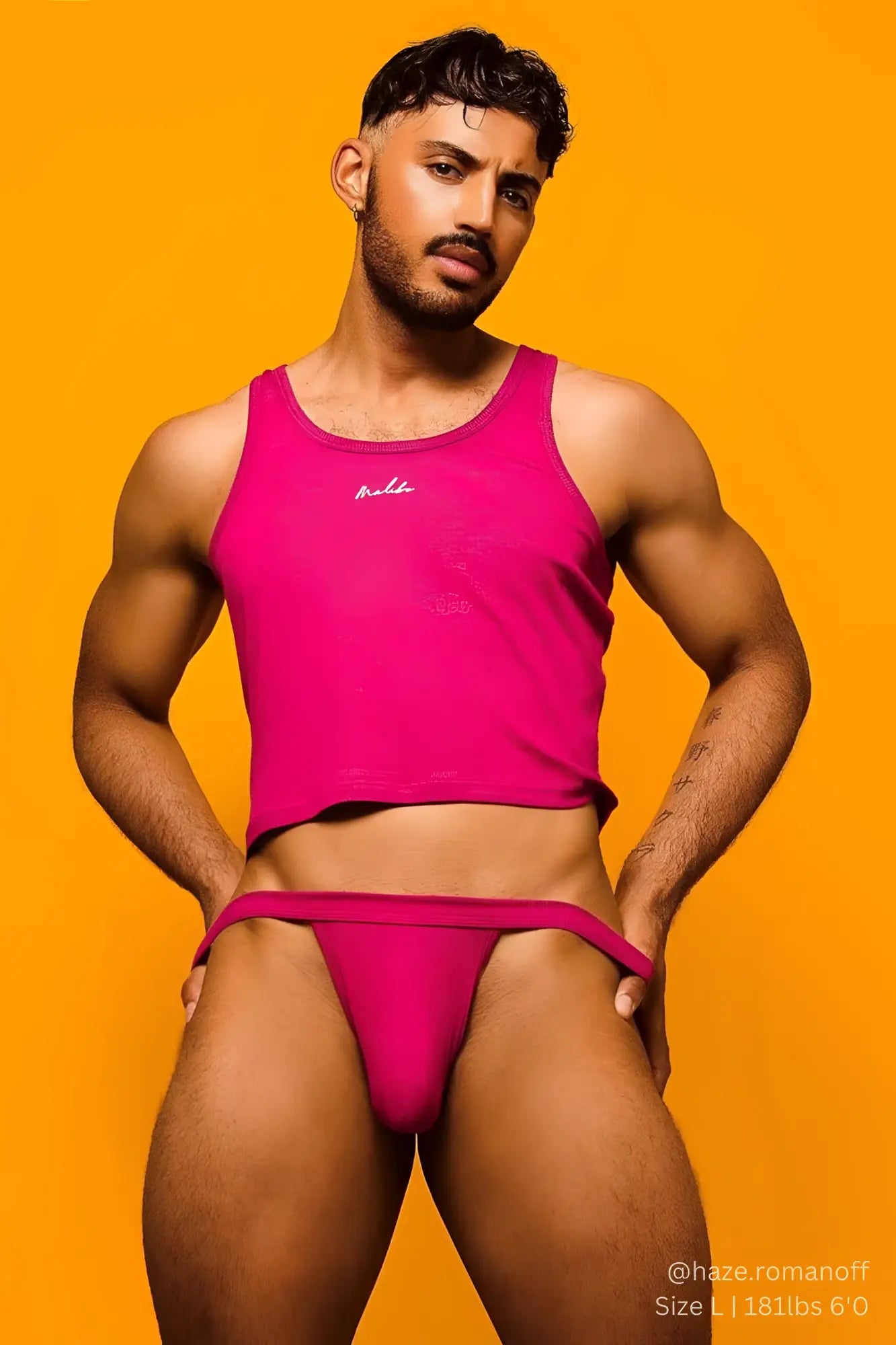Bright pink ribbed dreamy muscle fit cropped tank top with small embroidered logo on the chest