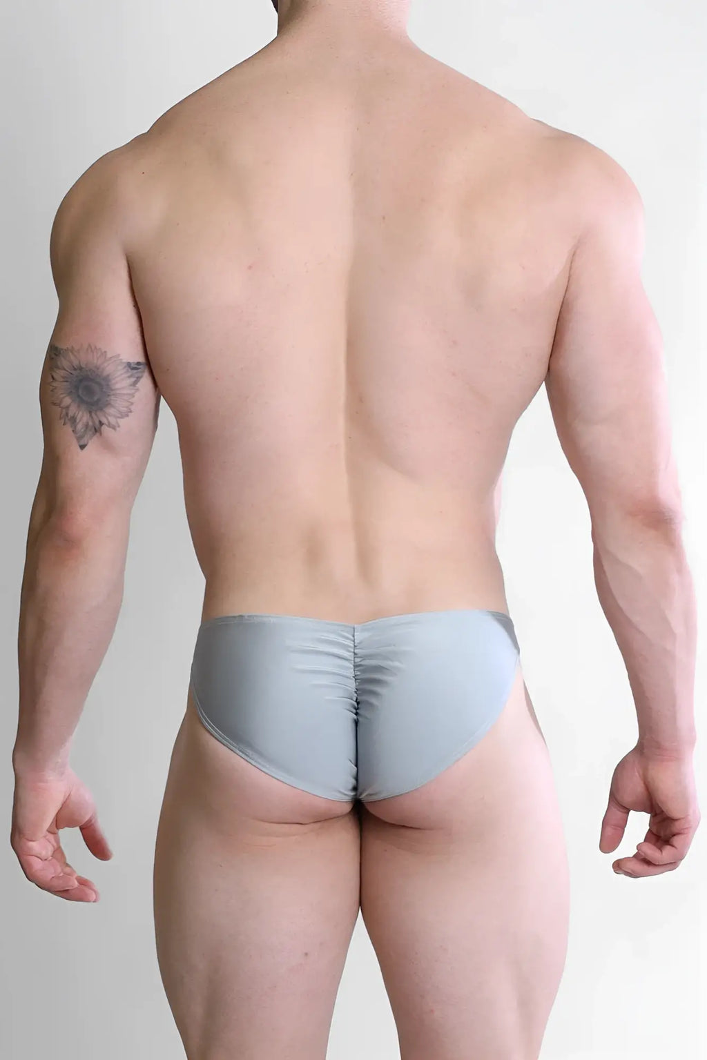 Light gray form-fitting briefs with a ruched back design showing the back side of the dynamic classic scrunch-butt brief chrome grey